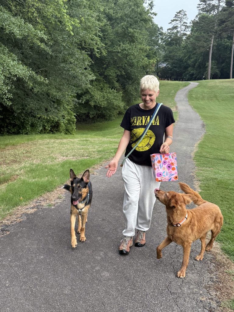 woman walking with two dogs
